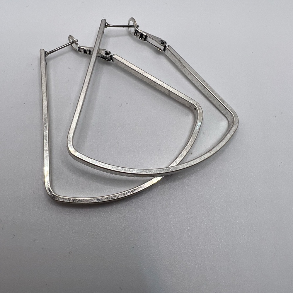 Silver hoop style earrings
